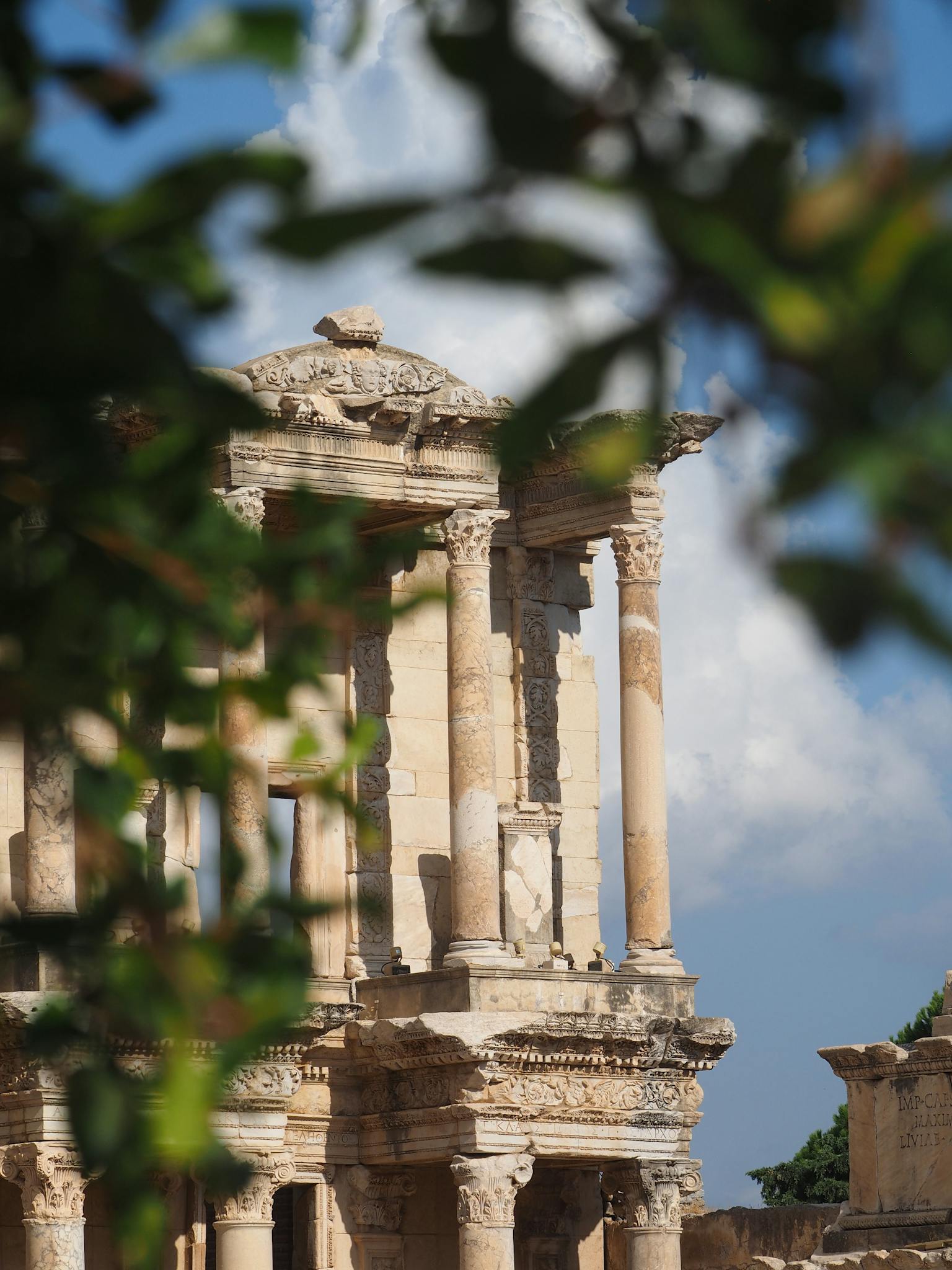 Explore the ancient temple ruins of Acarlar surrounded by lush greenery in İzmir, Turkey.